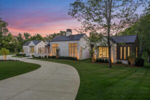 Hillwood luxury estate home in Nashville Tennessee featuring large lot and modern stone exterior