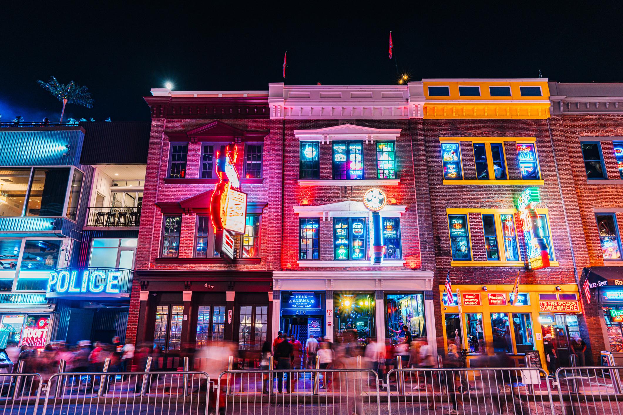 Tourists visiting Broadway Nashville honky tonks highlighting tourism demand for Airbnb properties