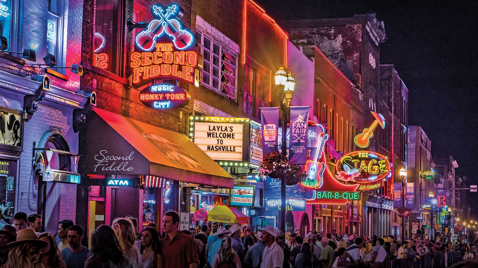 Lower Broadway Nashville nightlife crowds driving Airbnb demand near Lucy Nashville