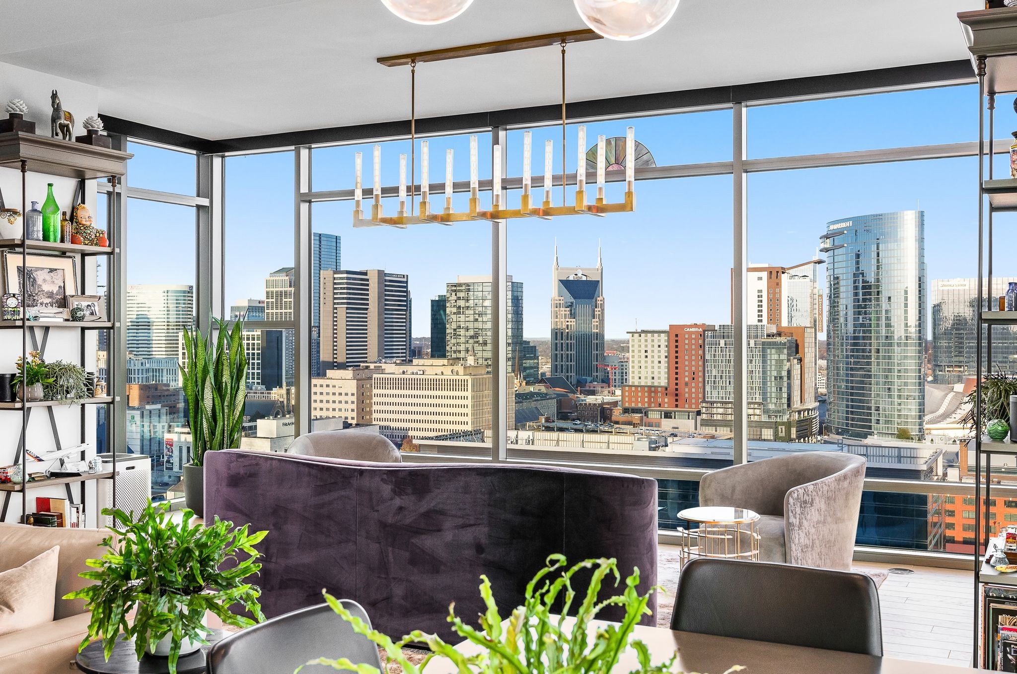 Twelve Twelve Nashville condo interior with floor to ceiling windows and skyline views