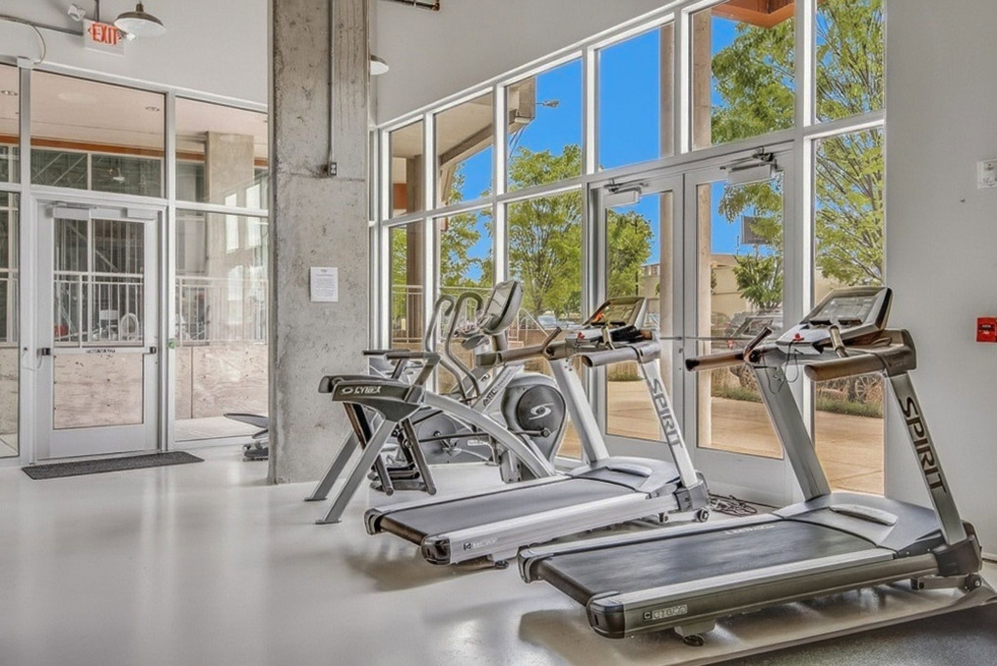 5th and Main condominium fitness gym with cardio and strength equipment at 2115 Yeaman Place in East Nashville Cleveland Park district 2008 mid-rise condo