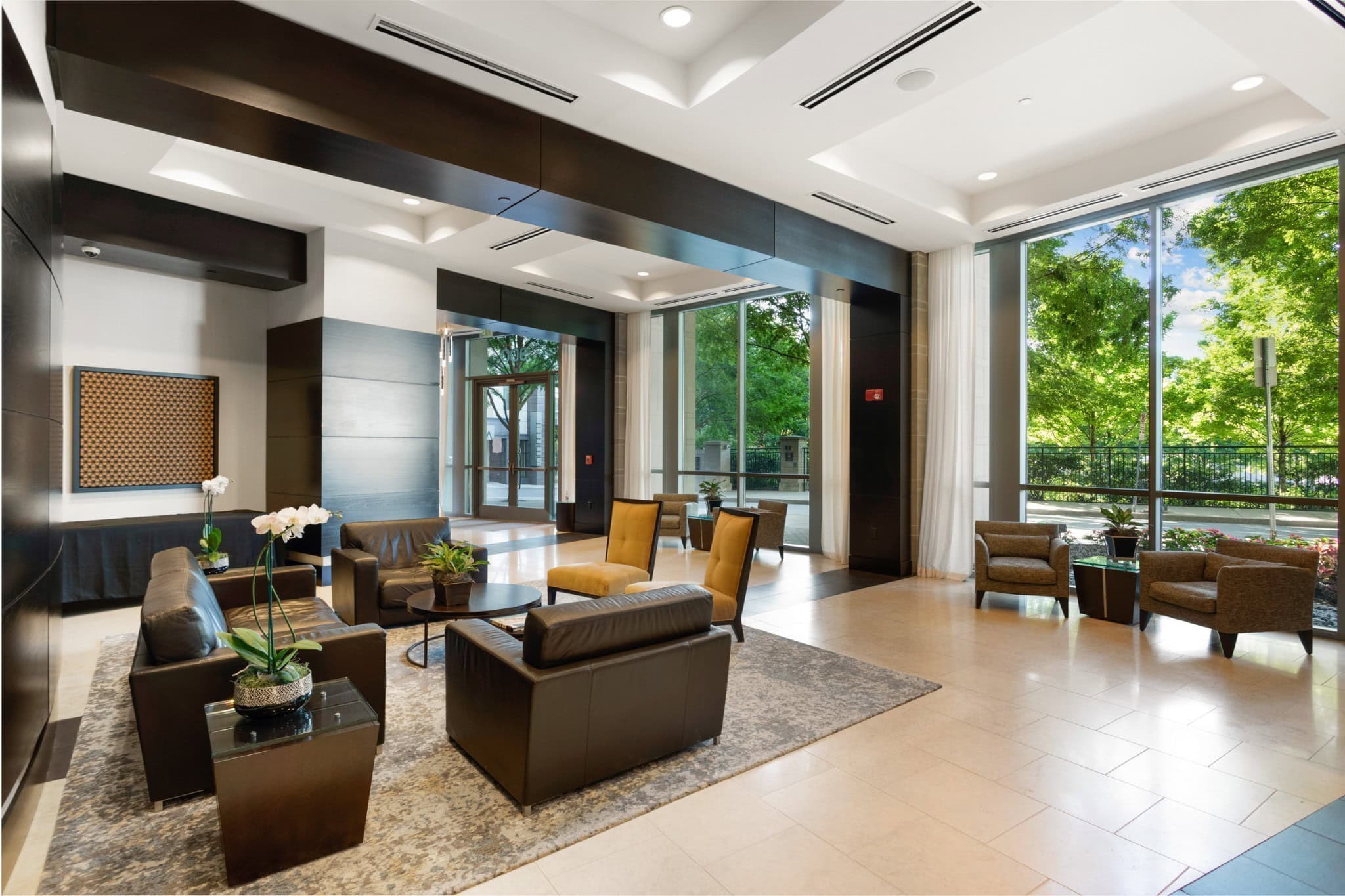 The Adelicia condominium lobby and entry at 900 19th Avenue South in Midtown Nashville, 2007 luxury condo tower with 24-hour concierge desk
