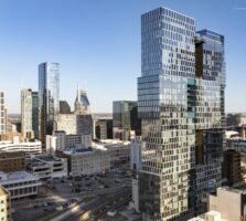 Nashville real estate stories May 3 2026: Alcove apartment tower at 900 Church Street, the 34-story 356-unit downtown high-rise listed for sale through Newmark, shown with the AT&T Building skyline in background