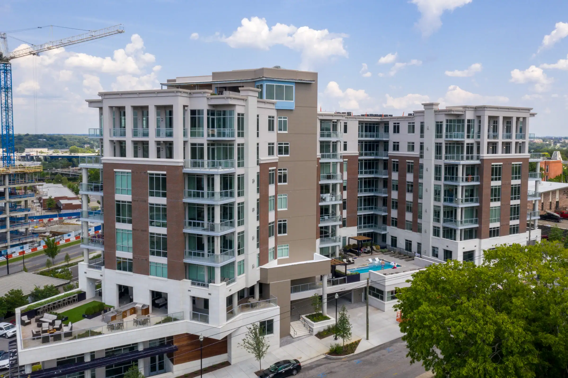 City Lights condominium interior with floor-to-ceiling windows facing Cumberland River and Downtown skyline