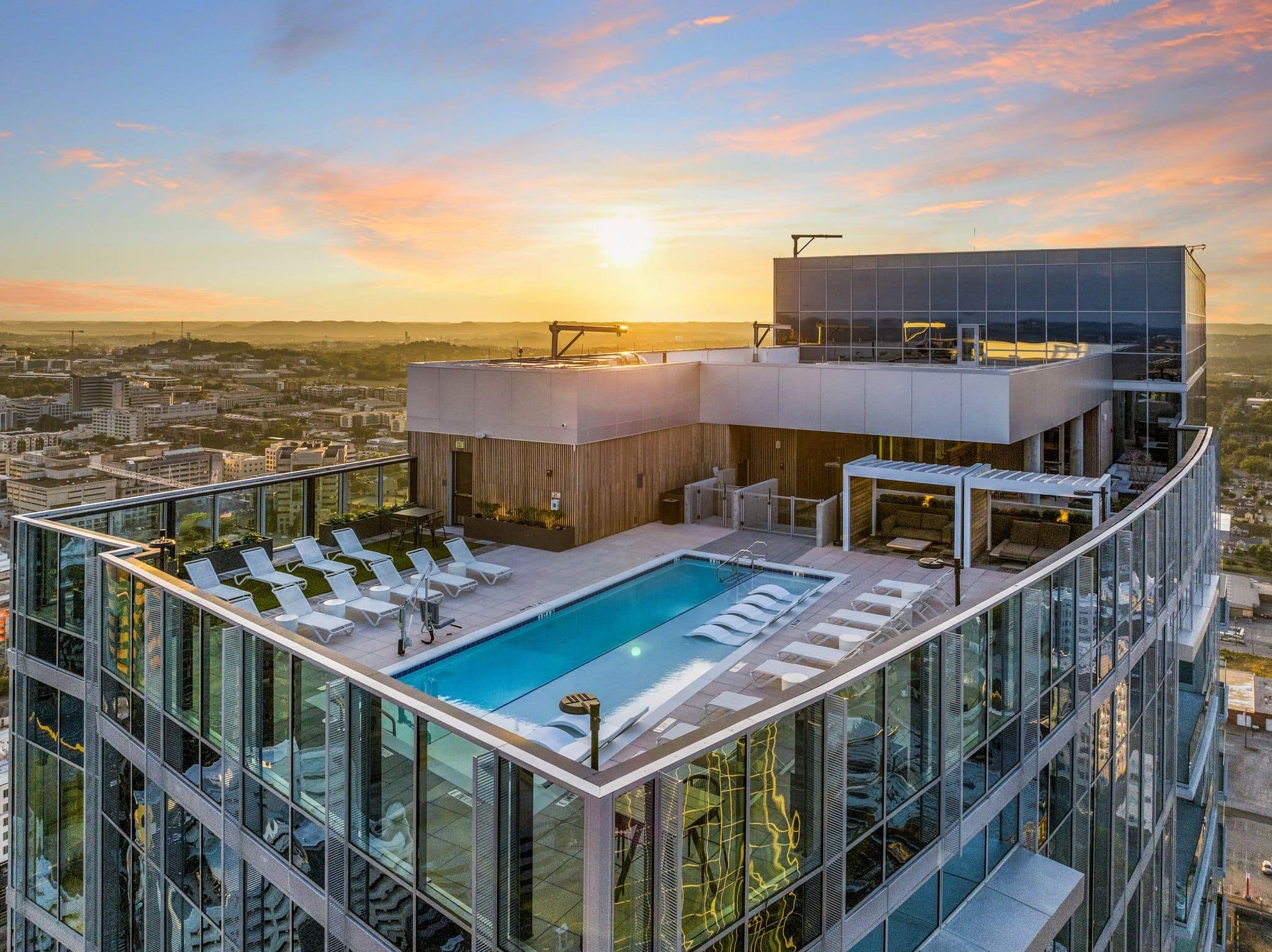 Residences at Broadwest rooftop pool deck with downtown Nashville skyline views from upper amenity floor