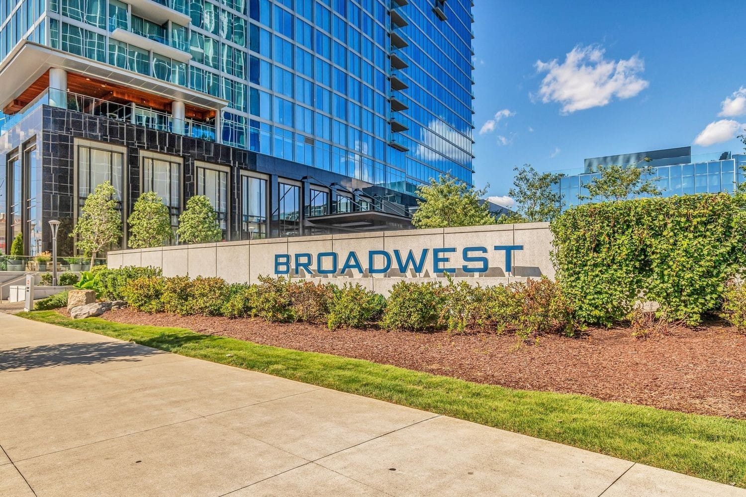 Residences at Broadwest 34-story tower exterior at 1616 West End Avenue Midtown Nashville with Conrad signage
