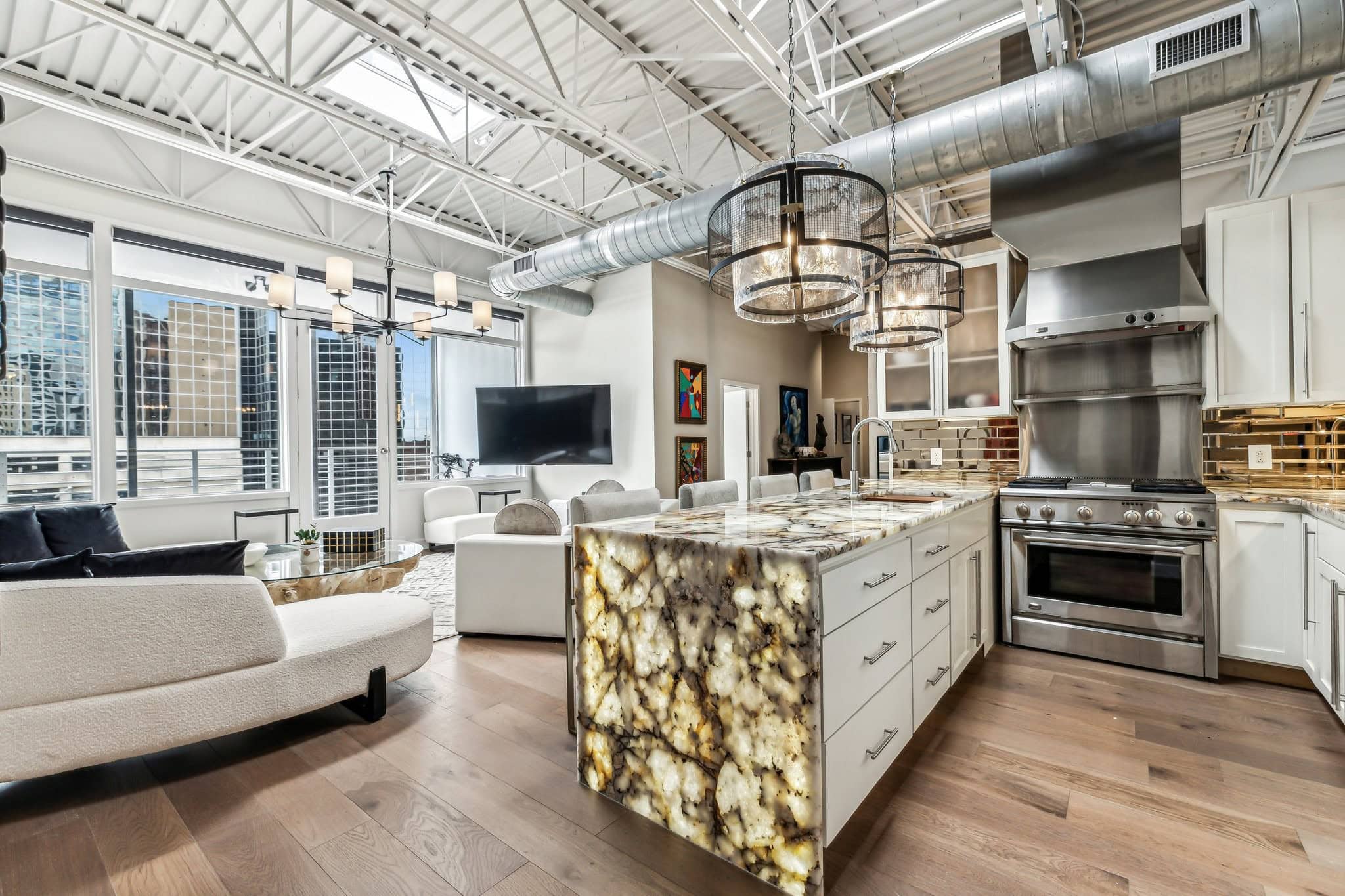 The Exchange Lofts penthouse interior at 309 Church Street in Downtown Nashville with floor-to-ceiling windows over the Church Street corridor Banner Block 2005 mixed-use condominium