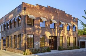 AJ Capital Partners 18-acre Wedgewood Village in Wedgewood-Houston Nashville with Hermès Brunello Cucinelli Pastis Soho House and Live Nation venue The Truth May 2026