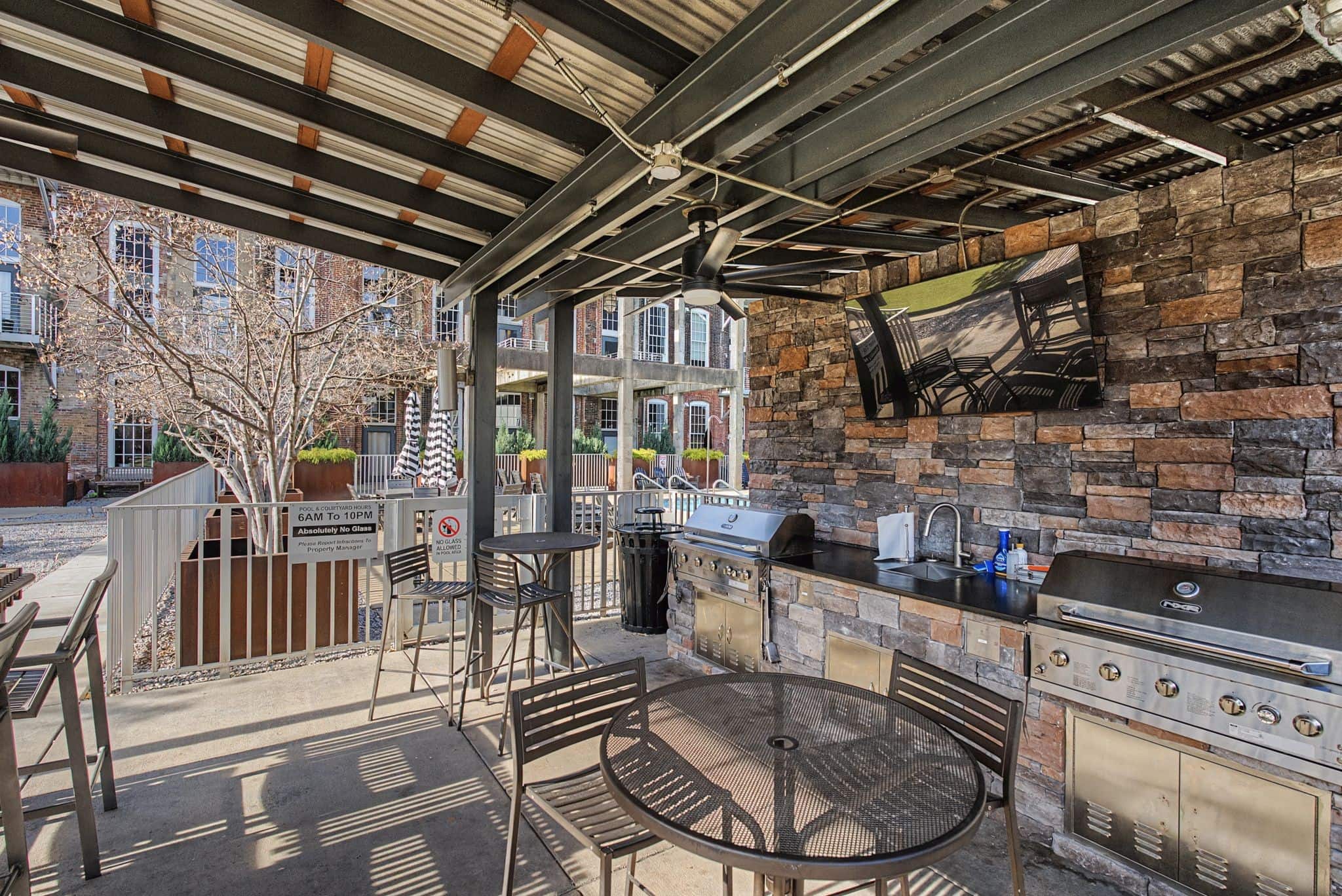 Werthan Mills Lofts industrial-loft condominium outdoor kitchen and grilling area at 1350 Rosa L Parks Boulevard in Germantown Nashville historic factory conversion 2005-2013