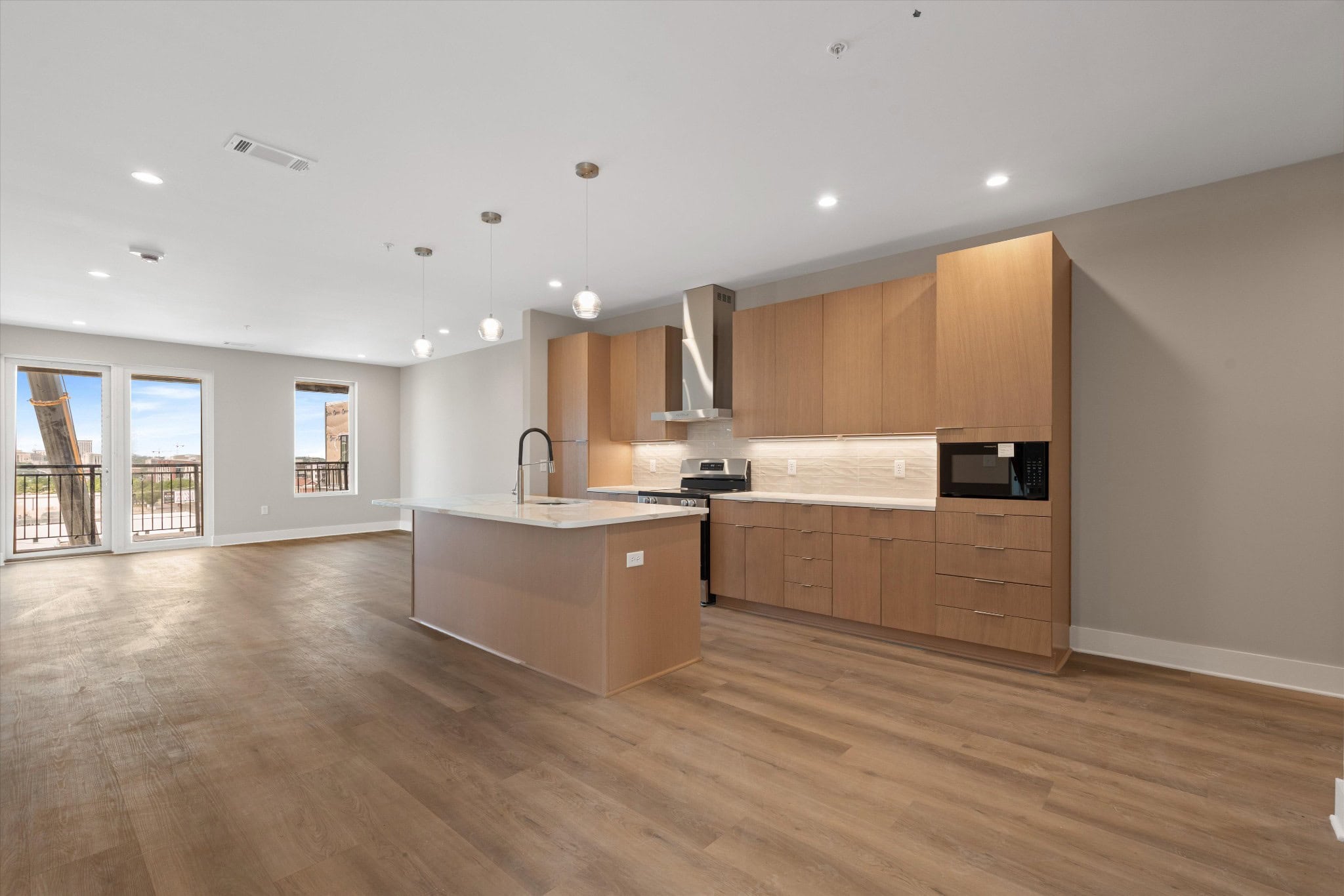 Interior view of a condominium unit at The Jesse in East Nashville, showing contemporary finishes and design-forward Smith Gee Studio interior