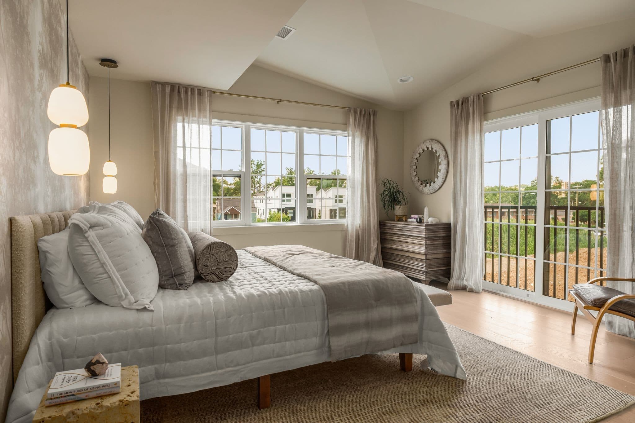 Primary bedroom at the Solaya Performance Showroom with natural light and Murphy Maude Interiors furnishings