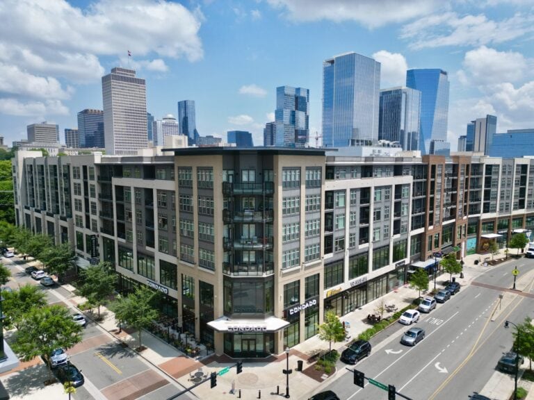 Nashville real estate stories week of June 7 2026 featured image showing a modern Nashville rental apartment building in the North Gulch neighborhood representing the broader Middle Tennessee real estate market shaped by Realtracs and Zillow listing distribution disputes, downtown tax policy debates, and rental market concessions