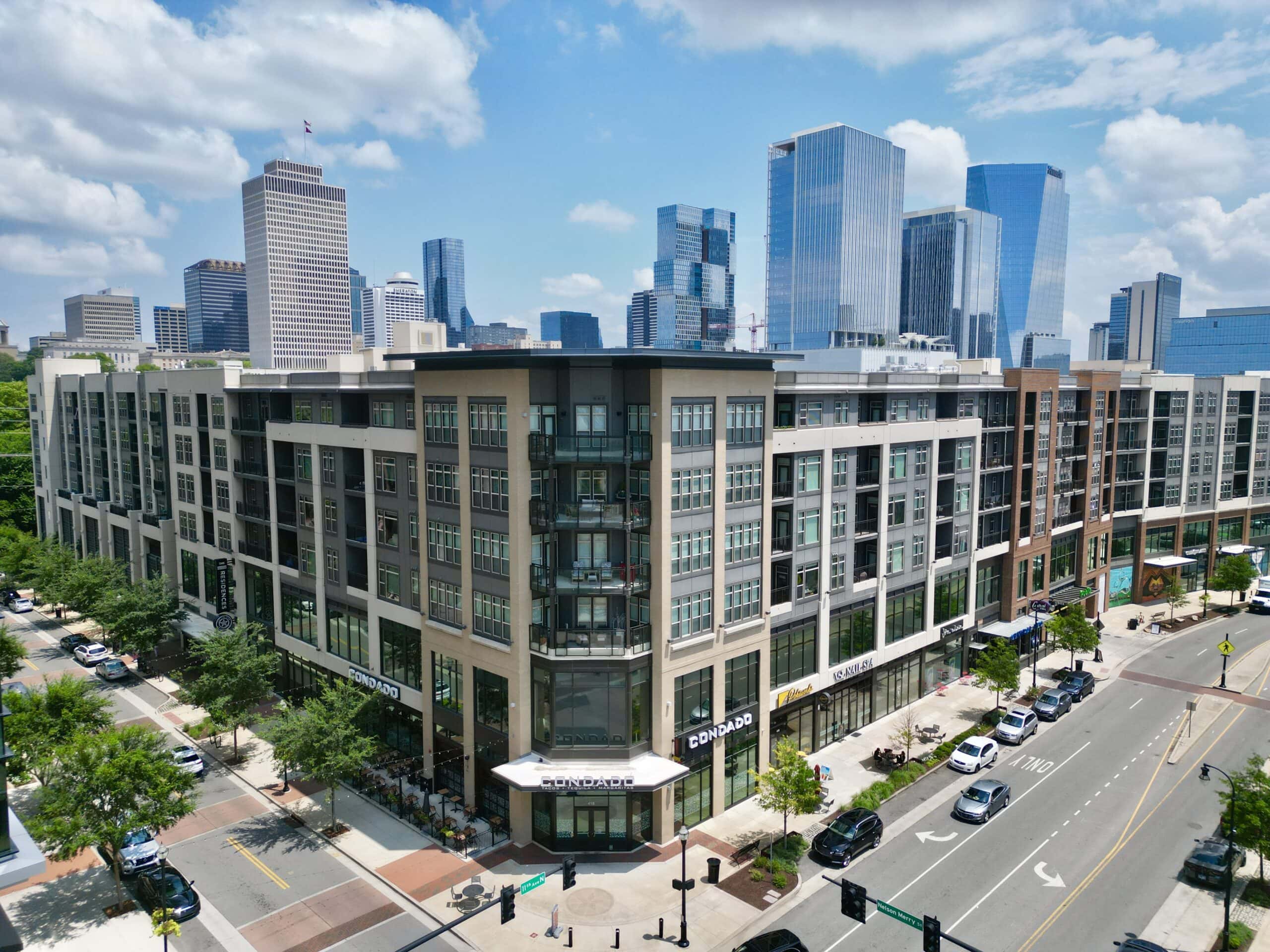 Nashville real estate stories week of June 7 2026 featured image showing a modern Nashville rental apartment building in the North Gulch neighborhood representing the broader Middle Tennessee real estate market shaped by Realtracs and Zillow listing distribution disputes, downtown tax policy debates, and rental market concessions