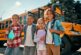 Students with backpacks and a school bus, representing Williamson County Schools attendance zones in Franklin, Tennessee.